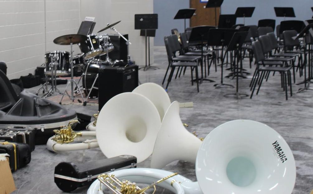 Band equipment and instruments sit on the floor of the wrestling room on Tuesday, Sept. 19.