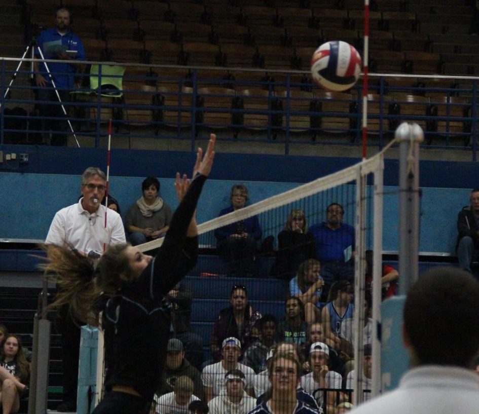 Lynzy Beitel goes up for an attempted block. 

