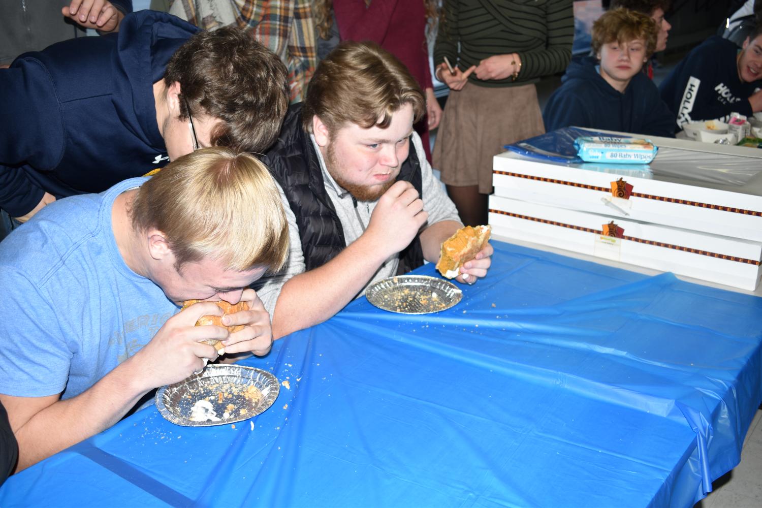 Seniors+Michael+Lajoie+and+Gunnar+Gronski+chow+down+on+whole+pumpkin+pies+during+pie+eating+contest+on+Nov.+21st.%0A