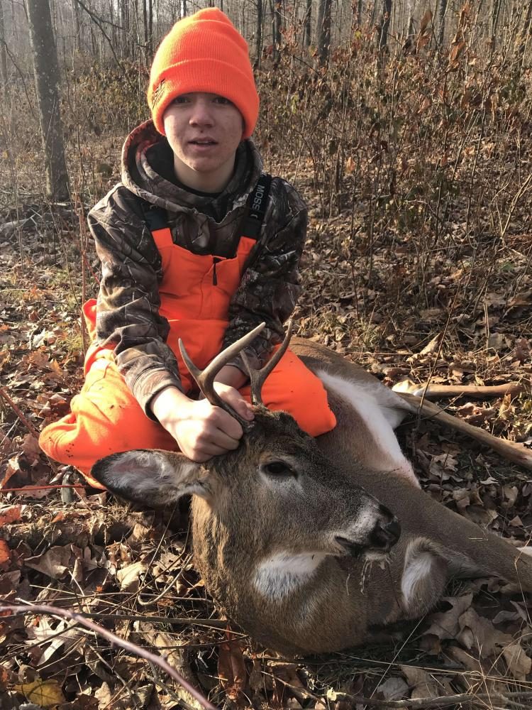 Freshman Hunter Wallace poses with his four point buck he shot during rifle season on Nov. 22.
