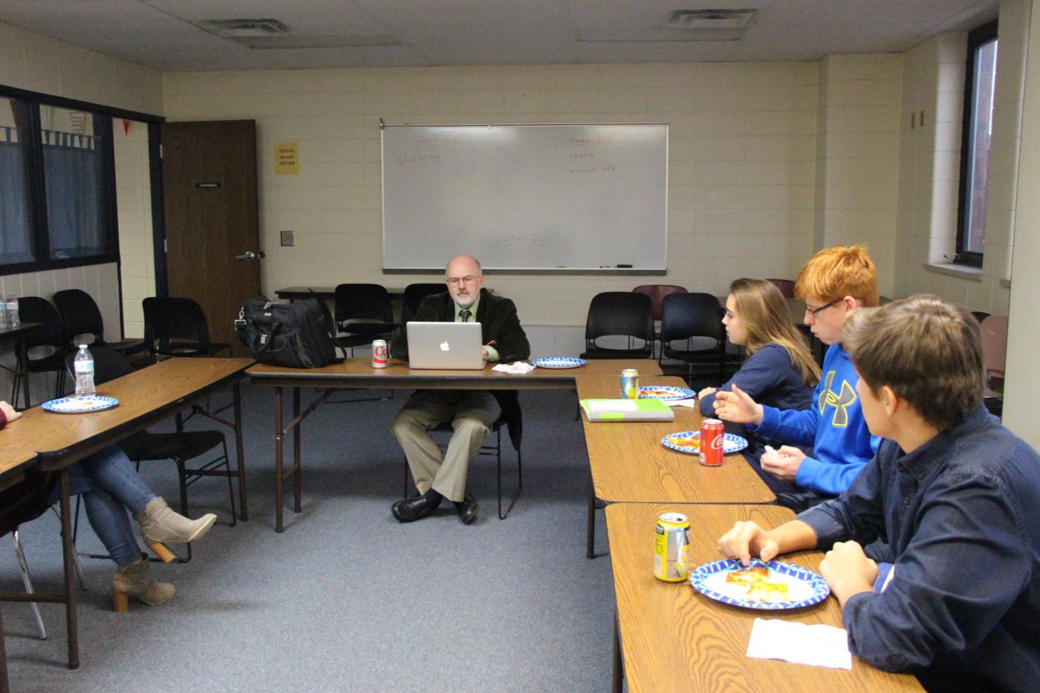 Students sit in the library conference room on Dec. 4 during A lunch to discuss a new superintendent. 