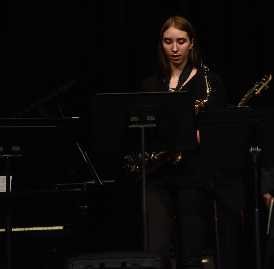 Junior Rae Dunbar prepares to play her saxophone in the jazz concert on Tuesday.