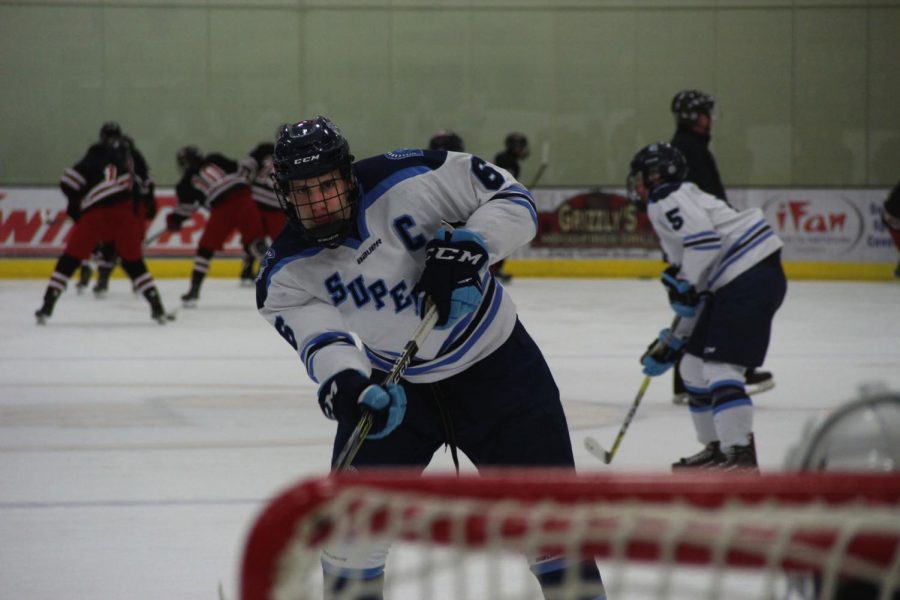 Senior+Max+Plunkett+goes+for+a+shot+during+warm-ups+on+Feb.+1+at+Wessman+Area+against+the+Duluth+East+Greyhounds.+