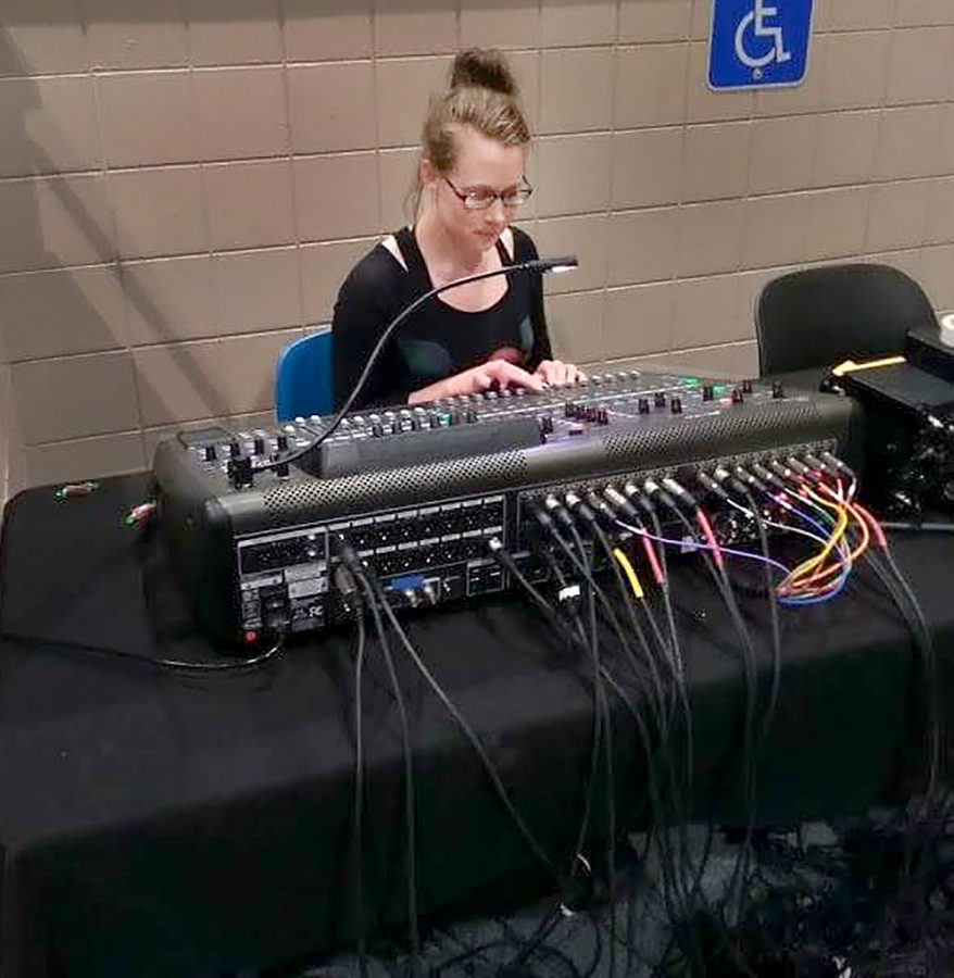 Senior Taryn Rhoads works on the soundboard during a rehearsal for “The Sound of Music” on Thursday, May 10, 2018. 
