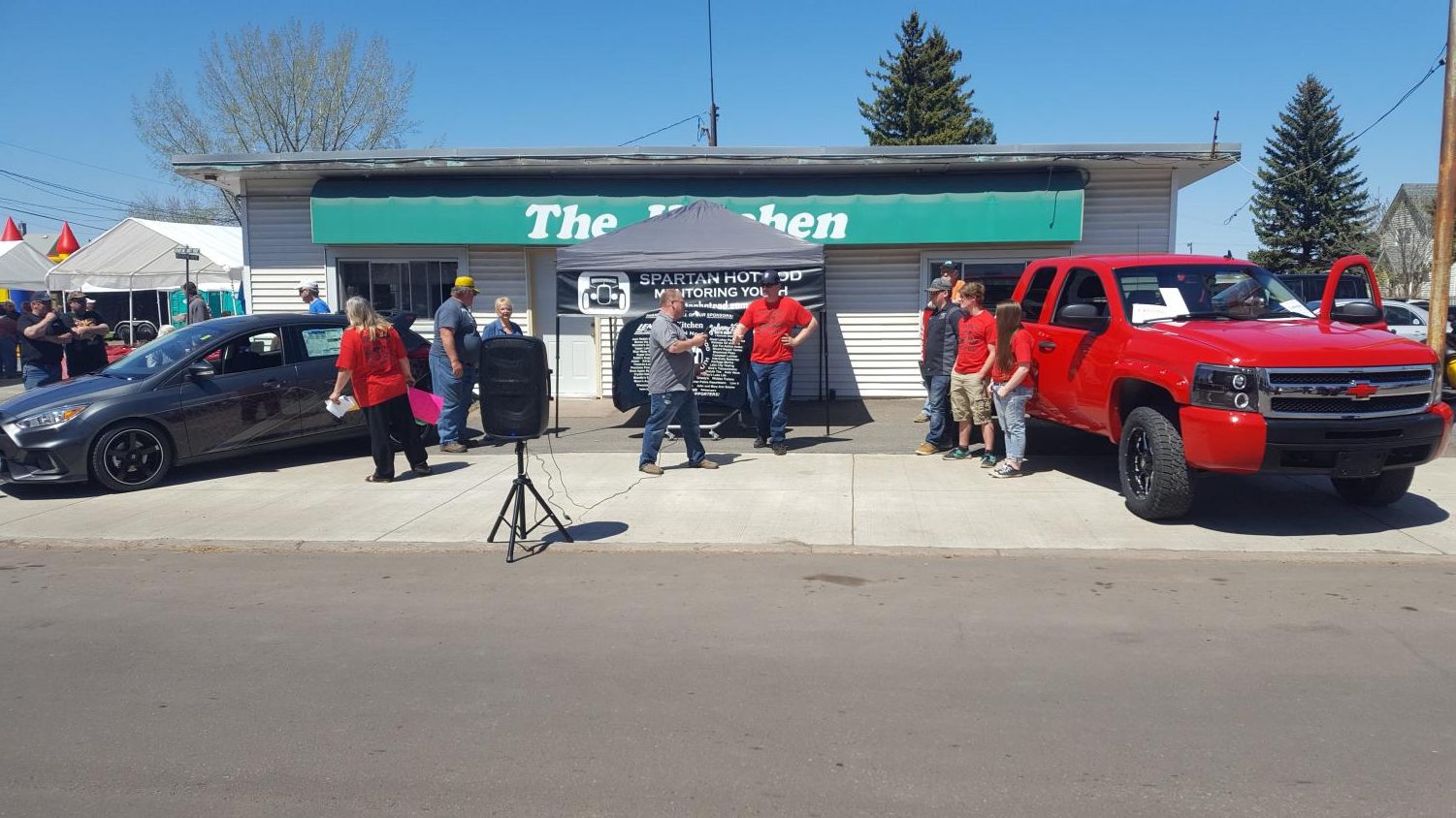 Mentor Brad Engstrom talks before the auction of the truck on May 20. The truck was worked on by seniors for their senior project then sold at the car show at auction.