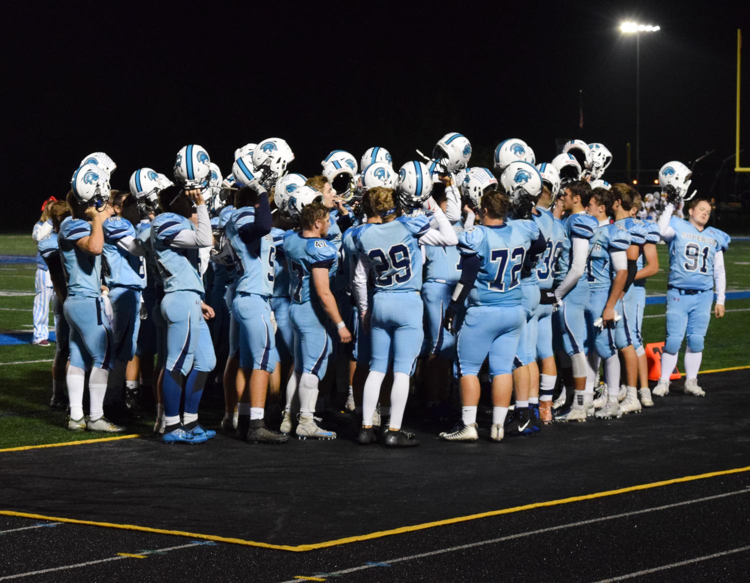 Cutline: Spartan football team huddles together as a team On Friday October 5th at Superior High sports complex