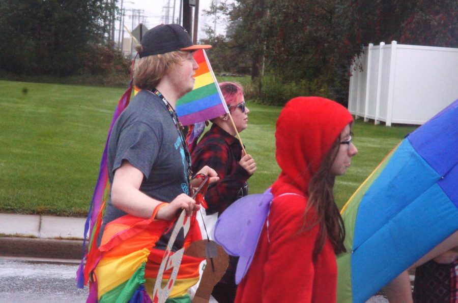 Senior student,Tristin Longstreet, marching alongside his friends and GSA members on Oct. 6, prior to the homecoming football kick off. 
