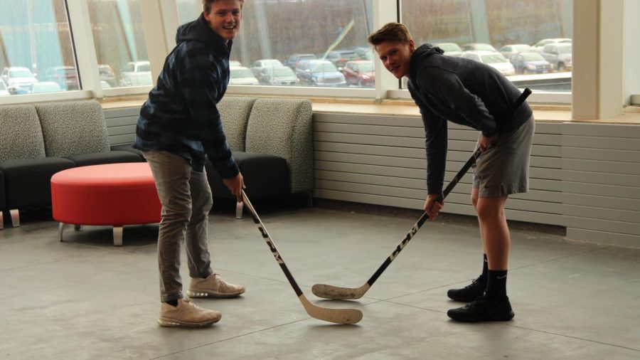 Juniors Spencer Gudowski and Gunnar Hansen face off in the 2nd floor balcony on November 6. The two hockey players are both participants in the Fellowship of Christian Athletes club.