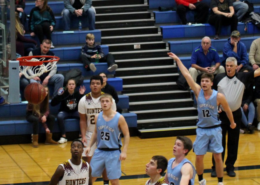 Senior+Beau+Severson+%2812%29+sinks+a+3-pointer+against+Duluth+Denfeld+in+the+SHS+gym+on+Dec.+6.%0A