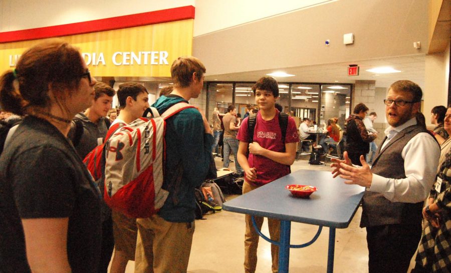 Junior Kaitlynn Andrs (left) talking to Mayor Jim Paine (right) in the Spartan Commons Wednesday, Jan. 16.