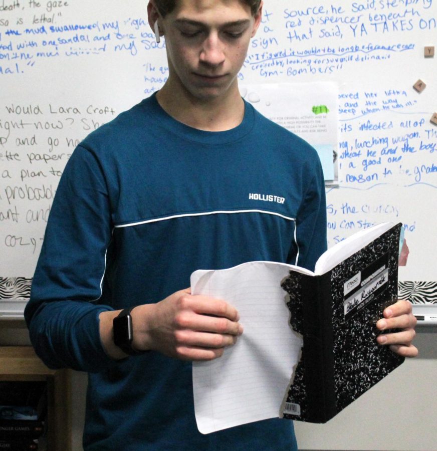 Freshman Brodie Raygor reads from his Writer’s Workshop notebook in Olivia White’s Language Arts 9 classroom on Jan. 7.