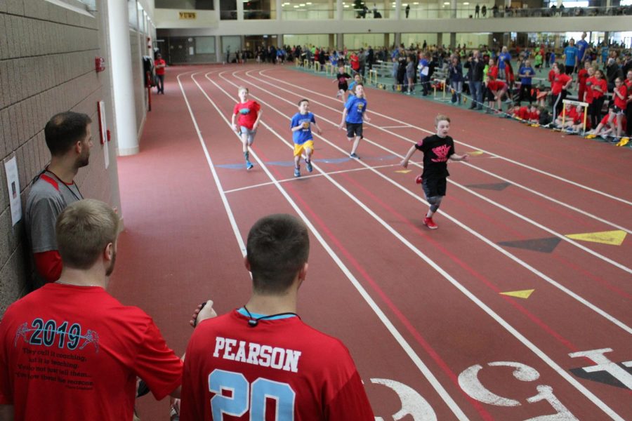 Junior Jarret Gronski and senior Steven Pearson time an event at the 5th grade Track-O-Rama on Mar. 7.  The high schools next meet is on Friday, Mar. 29.
