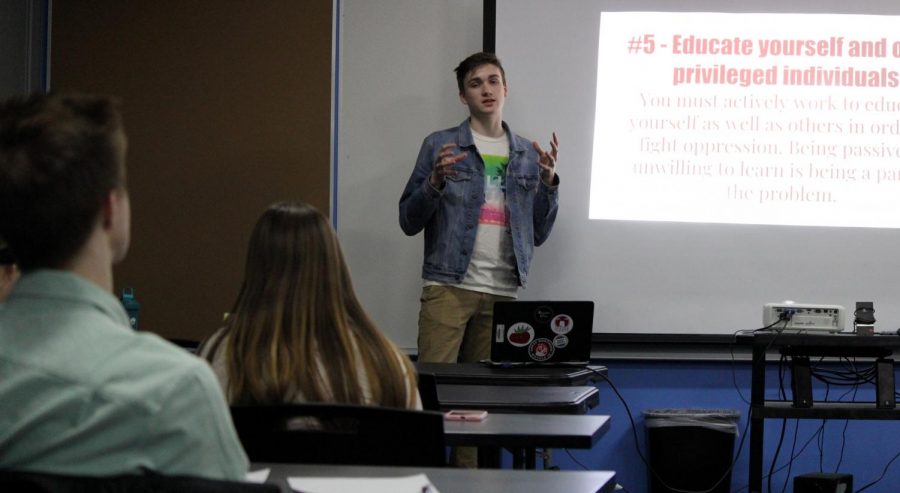 Thomas Chicka presents to a group of students and teachers on March 6 in the library conference room, informing them about privilege and how to become a better ally to the GLBTQ community.
