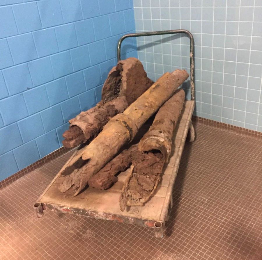 The Diving well’s old, rusted pipes lie on a cart in the pool room during summer 2018.
