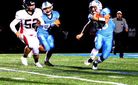 Junior Carter Fonger rushes with the football during Friday night’s Homecoming game in a 36-14 victory over Chippewa Falls.

