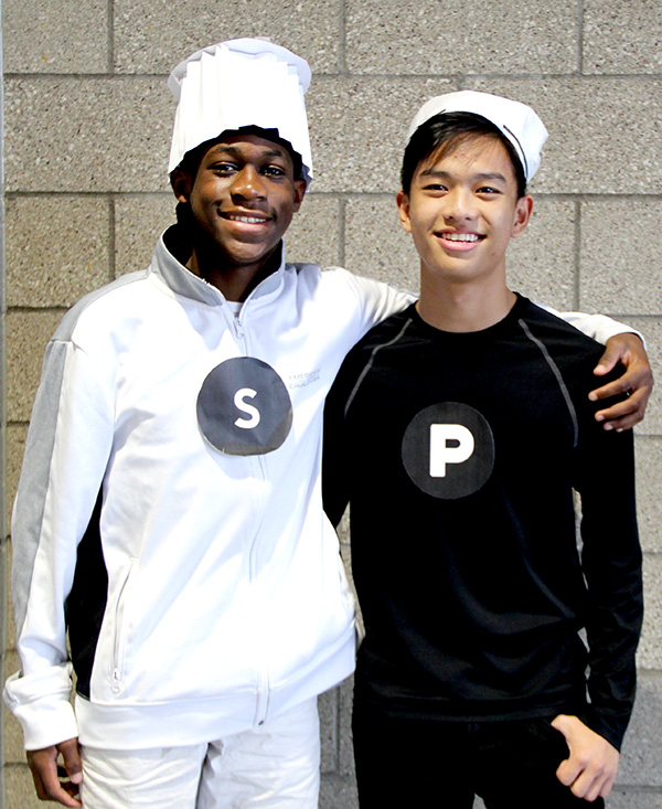 Sophomores+Kaine+Onwudiegwu+%28left%29+and+Nam+Nguyen+pose+as+salt+and+pepper+shakers+for+the+Student+Council%E2%80%99s+Halloween+Costume+Contest+on+Wednesday%2C+Oct.+30.+Students+showed+up+at+school+battered%2C+bloody%2C+and+costumed+for+the+contest%2C+which+was+held+during+A+and+B+lunch.+