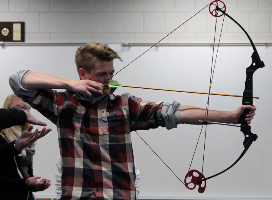 Senior Blaise Strom aims with his bow at archery practice Nov. 8. Strom has been shooting after he got into it from his love of the outdoors.