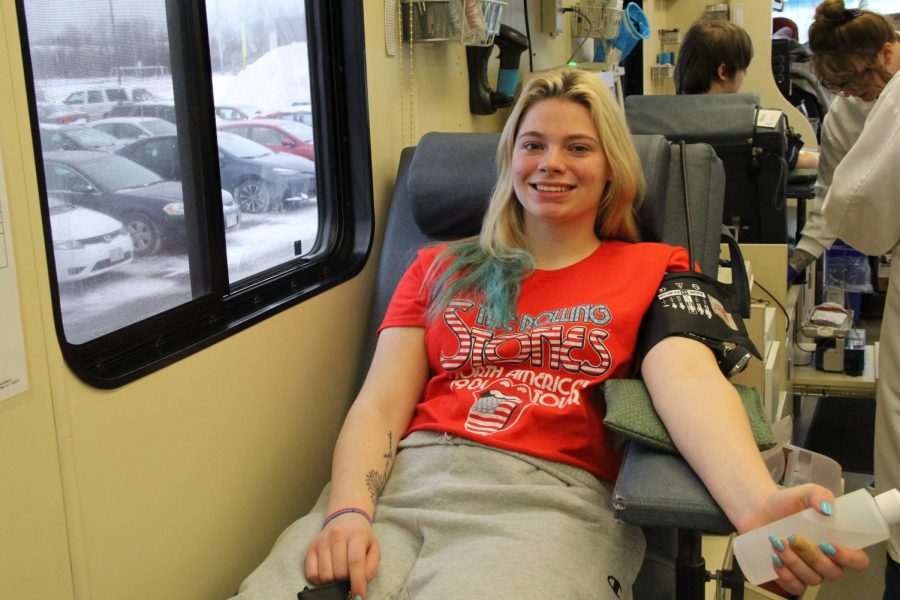 Senior Jessica Sundquist lays back on a cot inside the Memorial Blood Centers donation truck during her donation session on Dec. 13.  