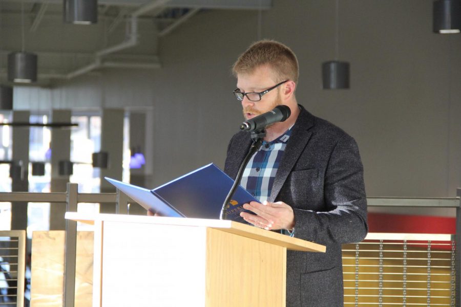 Mayor Jim Paine stands at a podium on the second floor’s main stairway at SHS on Feb. 24 to proclaim an official “We Love Our Public Schools Week.” Mayor Paine’s speech emphasizes the importance of education in Superior.