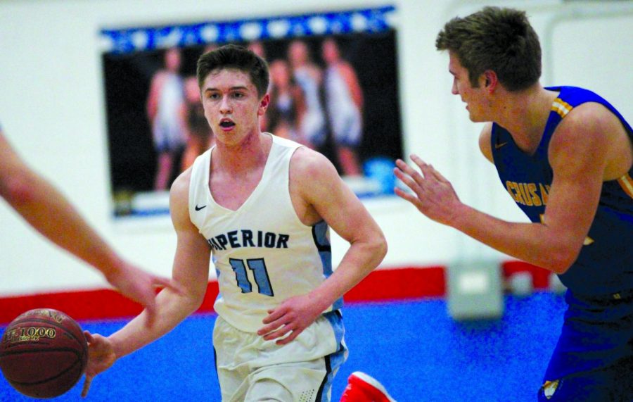 File Photo: Senior Joey Barker drives to the hoop against a Crusaders dendender at SHS Friday, Feb. 21. Barker, the highest scorer of the March 6 final game of the season, led the Spartans with 27 points against the team’s final opponent, the Neenah Rockets, in a 88-62 loss.