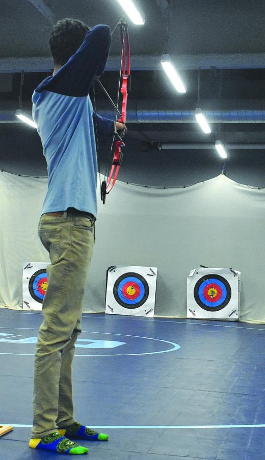 Freshman Jorden Hoffman practices for archery during the Half Hour Power Hour Feb. 14.  This time is used for clubs and support advisory, a lot of students use this period to socialize with friends in the commons.