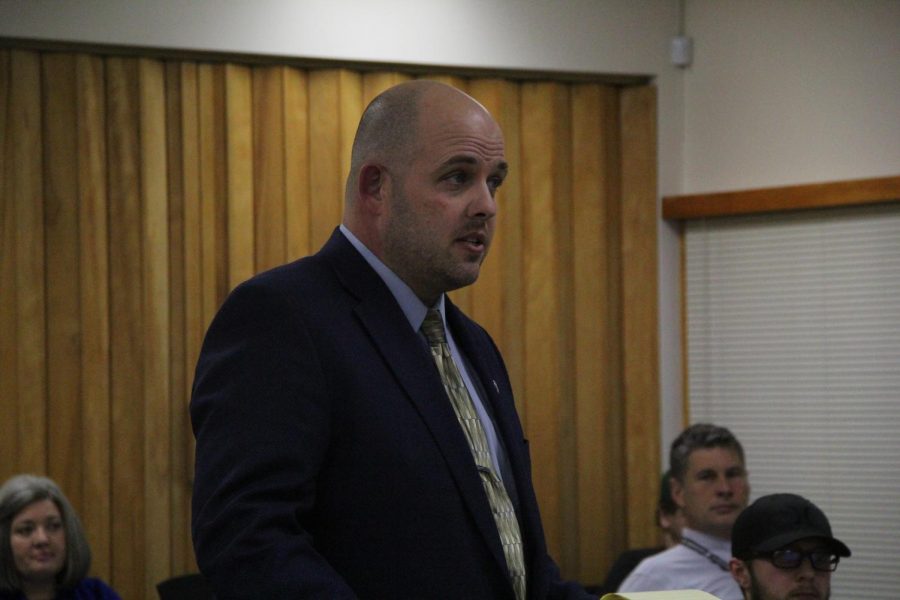  Senior Project advisor Rob Scott stands at the podium talking about changing the senior project guideline for future students at the Board meeting Feb. 4.