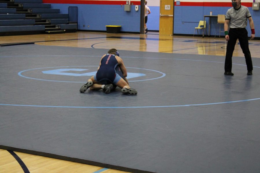 Sophomore Conner Krueger is winning against sophomore Caden Ostman on Tuesday Jan. 26 at the inner squad dual meet. 