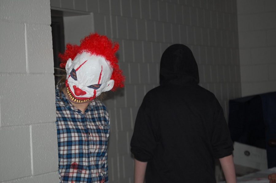 Student Council member Lily Walrath dressed up as a clown and scaring students in the Haunted Hallway. This was one of the Fright Night activities.
