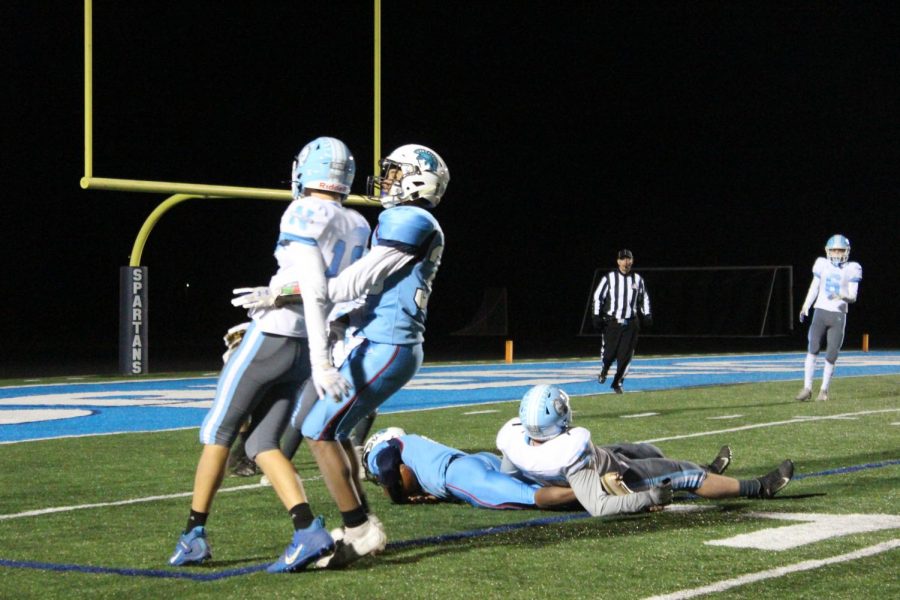 Sophomore Tresean Saniger attempts to block Eau Claire North football player at the game on Oct 21.
