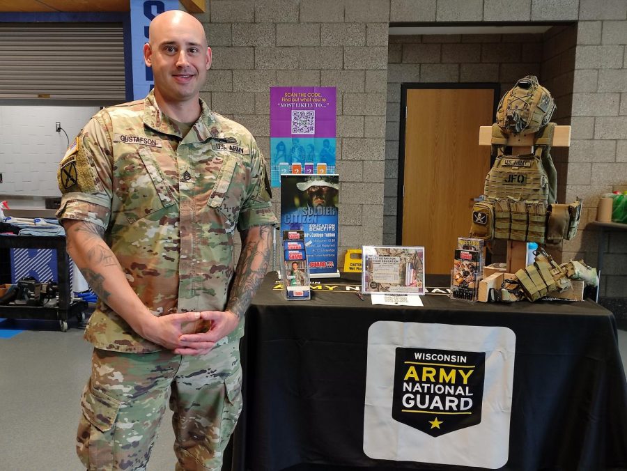 Nicholas Gustafson, Army National Guard Recruitment Officer, sets up at lunch on September 22 giving students the opportunity to enlist with education benefits. These include free education, and in some cases getting paid to go to school. 