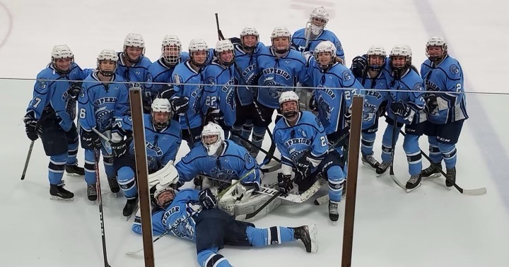 Girls+hockey+pose+for+a+team+photo+after+their+5-3+victory+over+Northern+Tier+at+Isanti+Ice+Arena+on+Nov.+20.