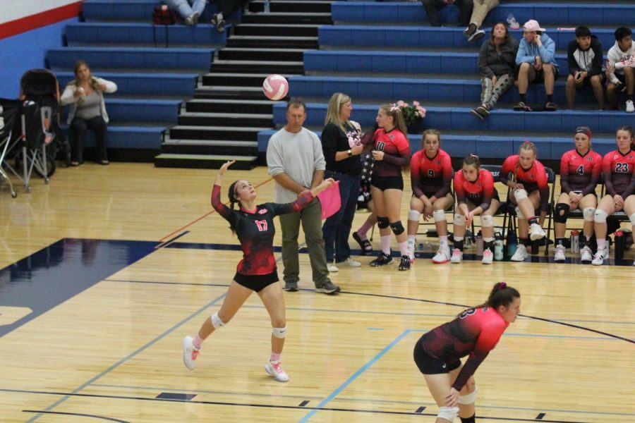 Sophomore+Savannah+Hering+serves+the+ball+at+the+high+school+gym+on+Oct.+5.+The+team+raised+over+%246%2C500+at+this+years+event.