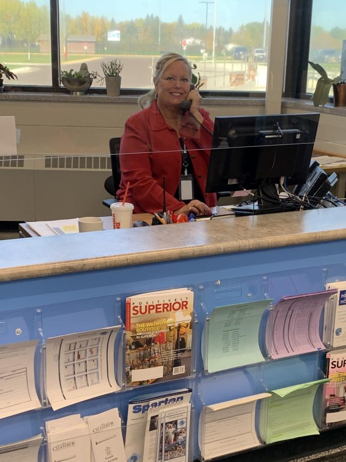 New Secretary Cheryl Shockley working at her desk in the main office. 