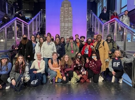 Students pose for a photo at the Empire State Building on the spring break trip March 12.