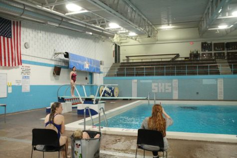 Diving Coach Kate Long helps Sophomore Ellen Hollenback during practice at SHS on September 26, 2022.