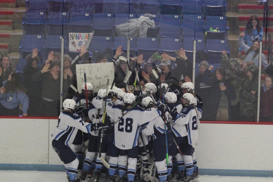 Girls hockey team celebrating with the study after they beat Hayward to go onto state on Feb. 25, 2023.