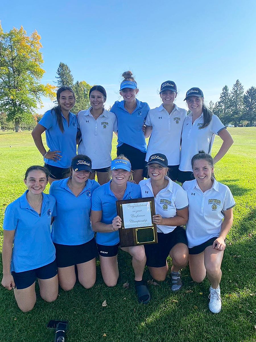 Spartan and Hayward Girls Varsity Golf pose for a picture with the Conference Championship plaque. 