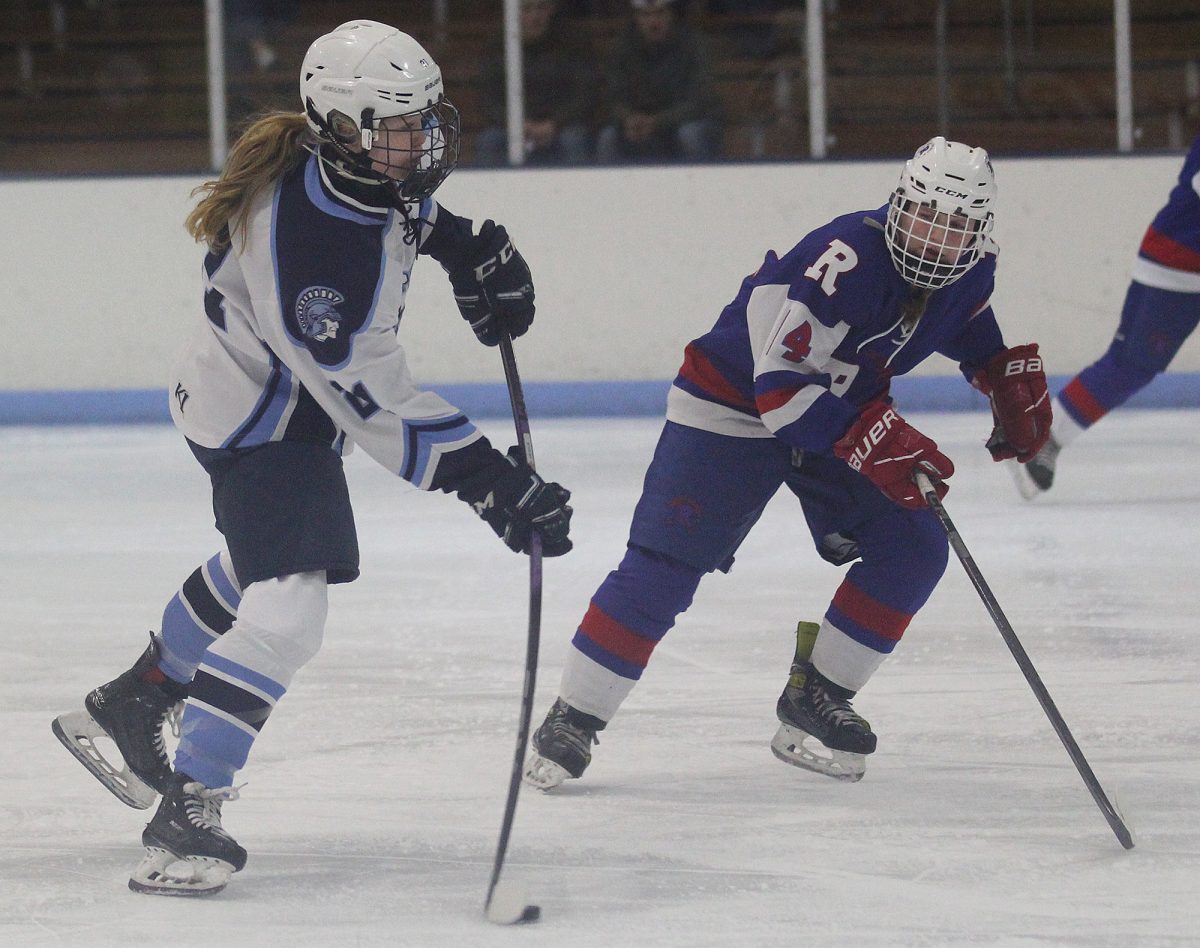 Senior Autumn Cooper shoots the puck in the first period at Superior Ice Arena. Cooper scored four goals to lead the Spartans to a 5-2 victory.
