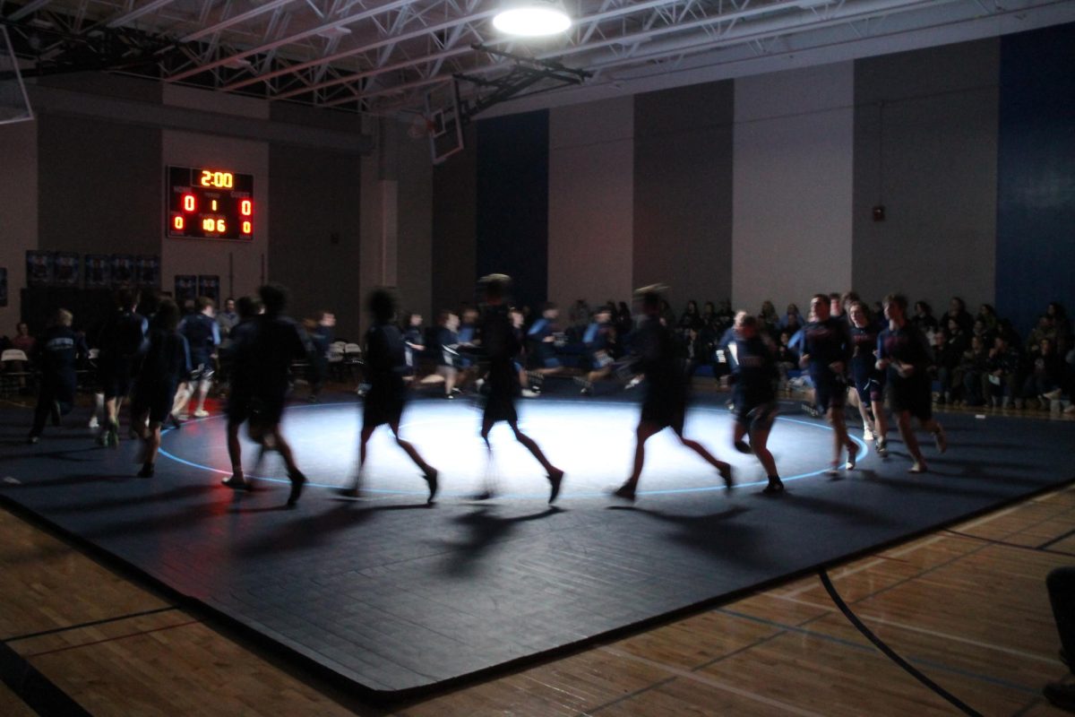 Spartan Wrestlers warm up before their match against Ashland in the auxiliary gyms on Dec. 14, 2023. 
