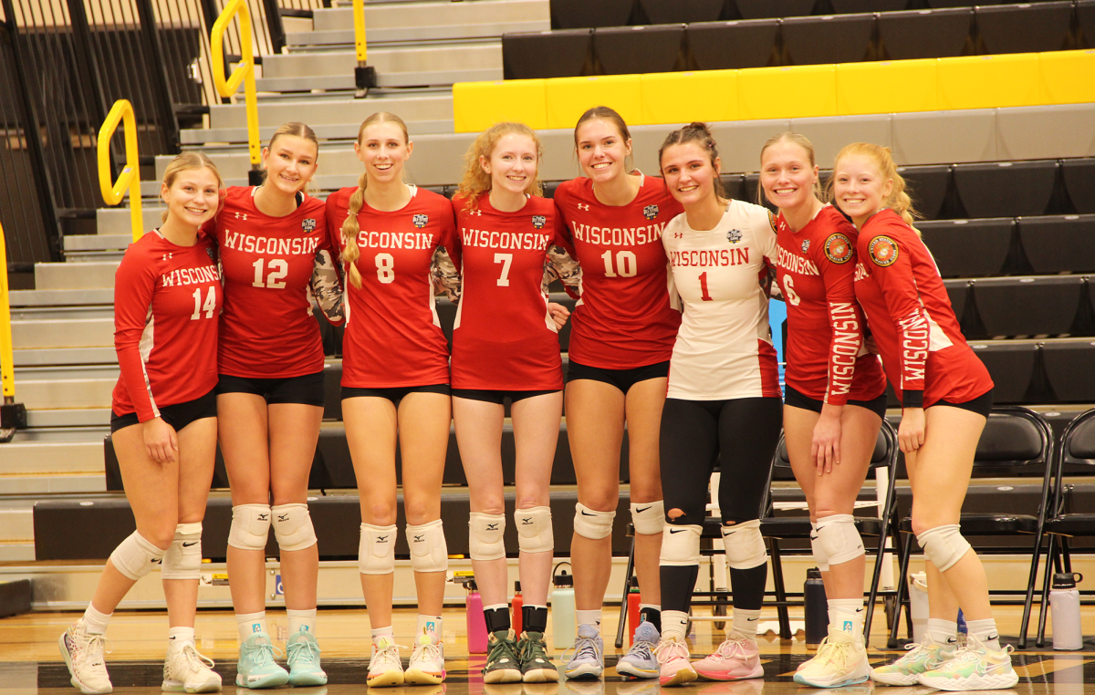 Wisconsin+team+poses+on+bench+during+second+set+of+the+game+in+the+UWS+gym.+