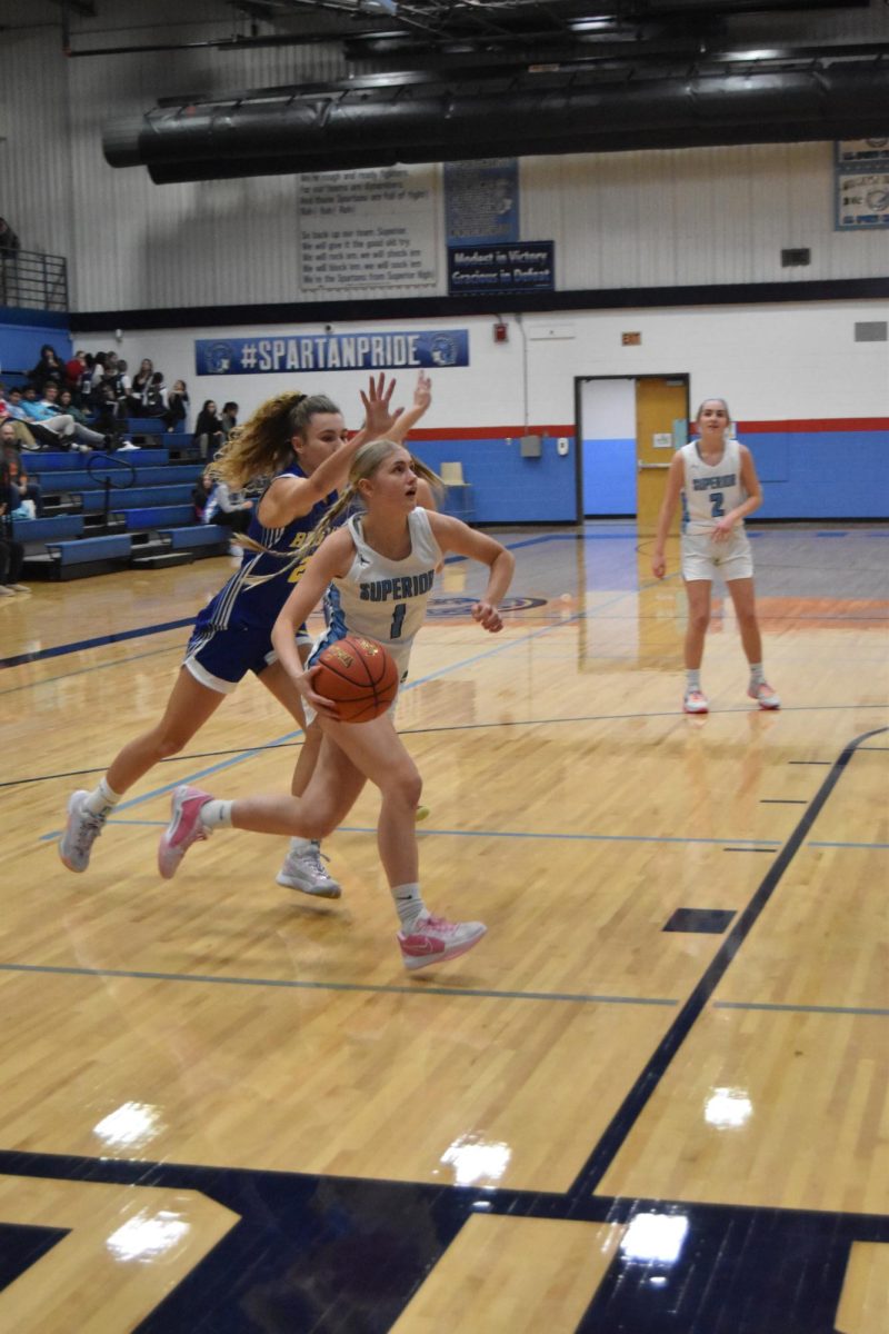 Sophomore Ava Meierotto (1) sprints past Rice Lake defenders for a layup