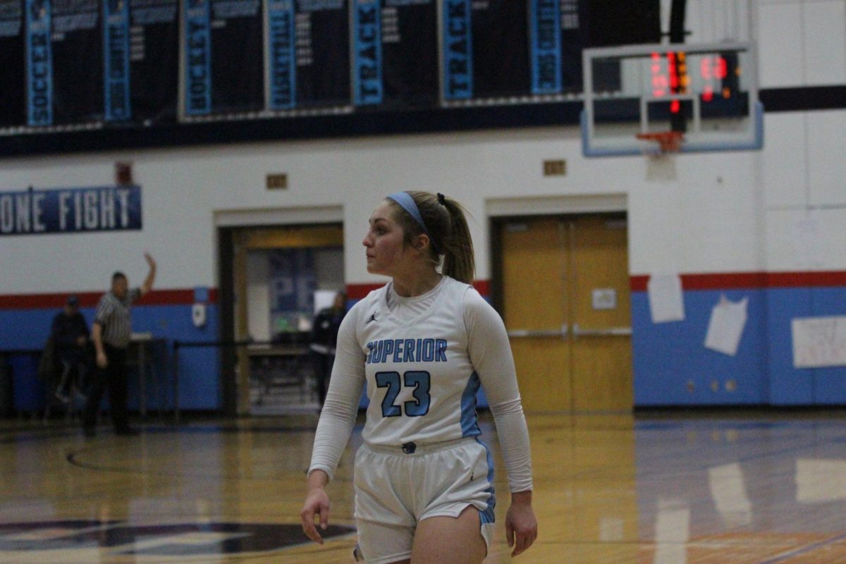 Superior’s senior Eva Peterson (23) walks off the Spartans arena court for the last time after the Spartans’ 64-49 loss in the regional semi-final.