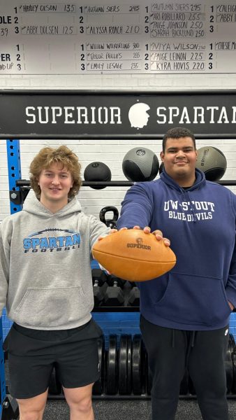 UW-Stout commits senior tight end Lucas Williams (left) and senior offensive linemen Braylon LeMiuex pose in the weight room on March 2, 2024.