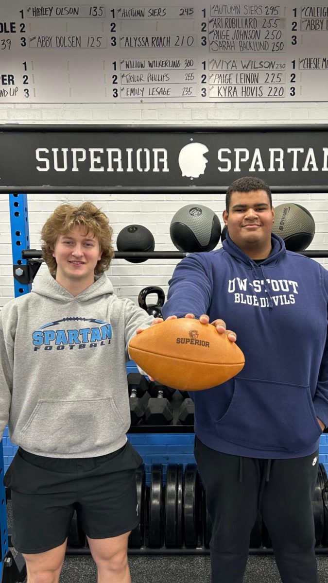 UW-Stout commits senior tight end Lucas Williams (left) and senior offensive linemen Braylon LeMiuex pose in the weight room on March 2, 2024.
