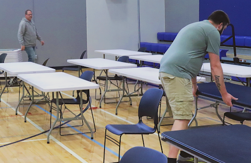 Bill Cockerham, School Staff (Left) & Brian Berndt, School Staff, put away tables after AP Testing on 5/15/24.
