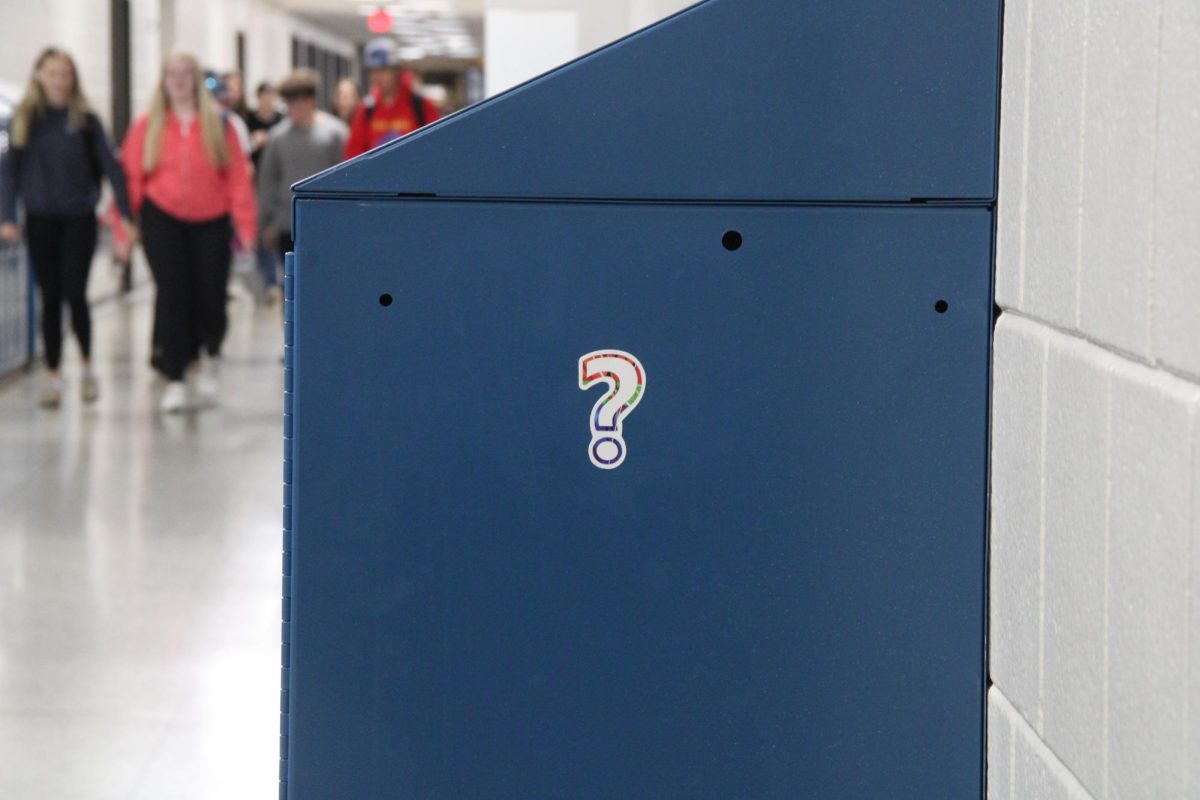 A quizzical sticker perches on the side of a locker while students leave from A lunch on May 29, 2024.  