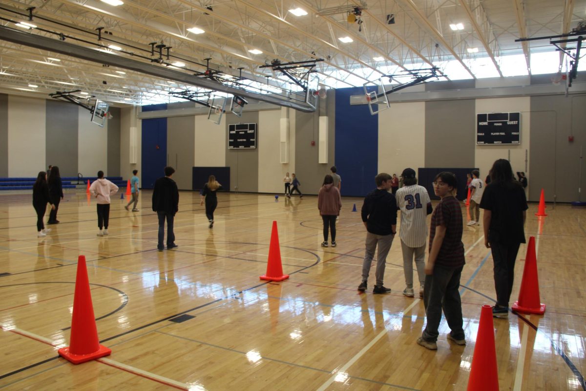 Students Play mat ball in Their lifetime fitness and activities class. A lot of students don't try in gym games but these ones did