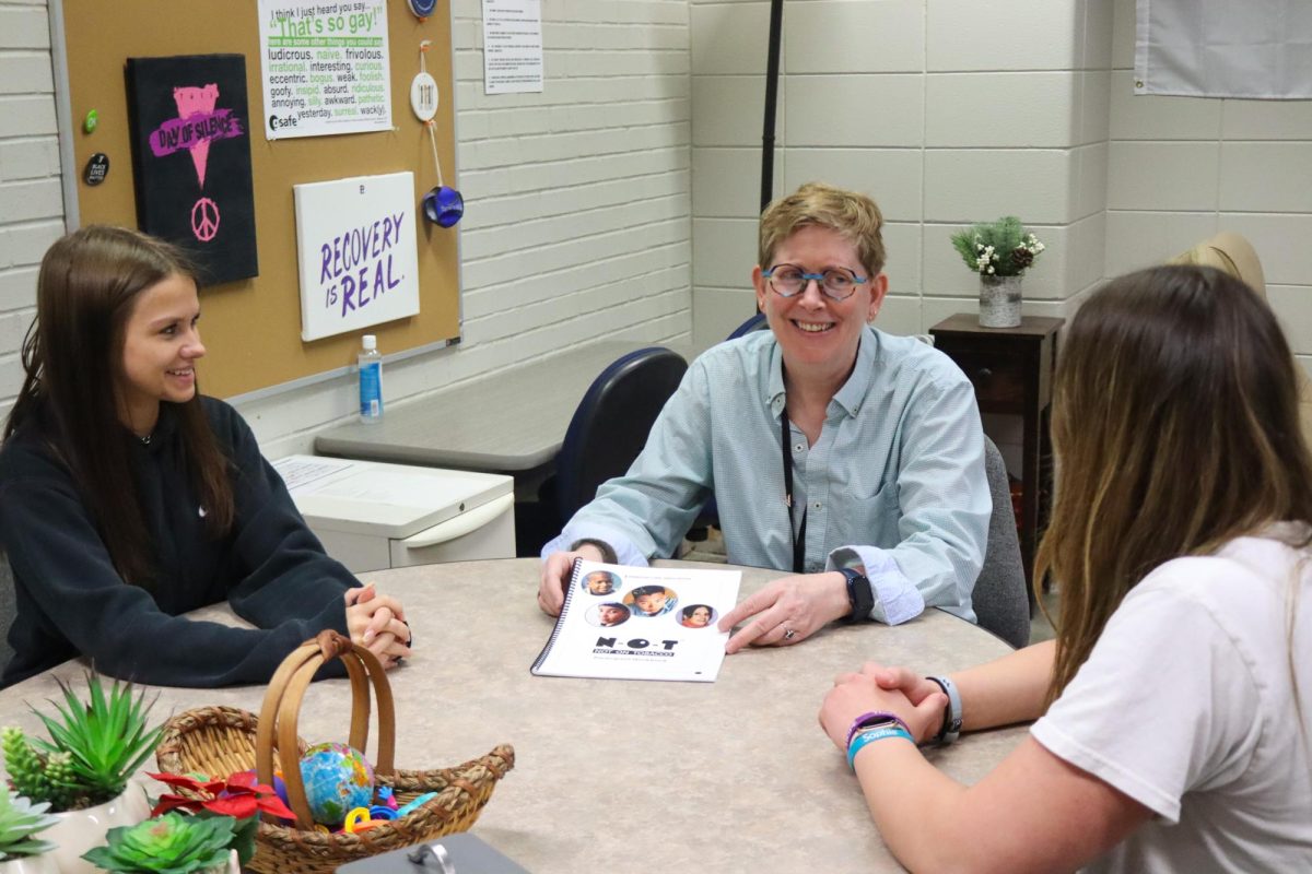  Social worker Jane Larson (center) counsels junior Jayden Gunnarsen (left) and junior Makaela Reinke (right) in Larson’s office May 6, 2024. This is what her typical NOT (Not On Tobacco) groups look like. 
