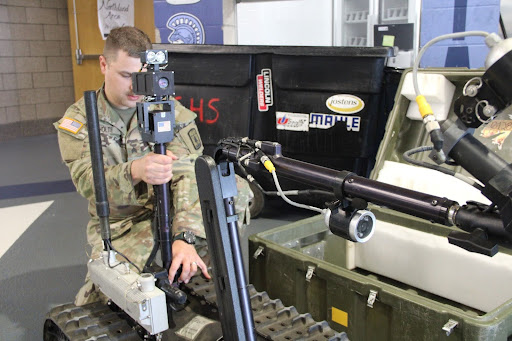 Sargent Leif Holte Assembles the Talon Robot in preparation for the lunch periods. Sargent Holte uses the Talon Robot to demonstrate how the National Guard would collect a bomb if there was one found in a culvert system and other things like that.