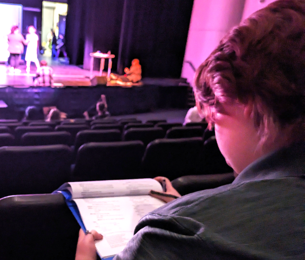  Senior Lily Holmquist annotates a script for The Wizard of Oz In the Performing Arts Center on May 3, 2024. Holmquist is a stage manager, even for her final show.